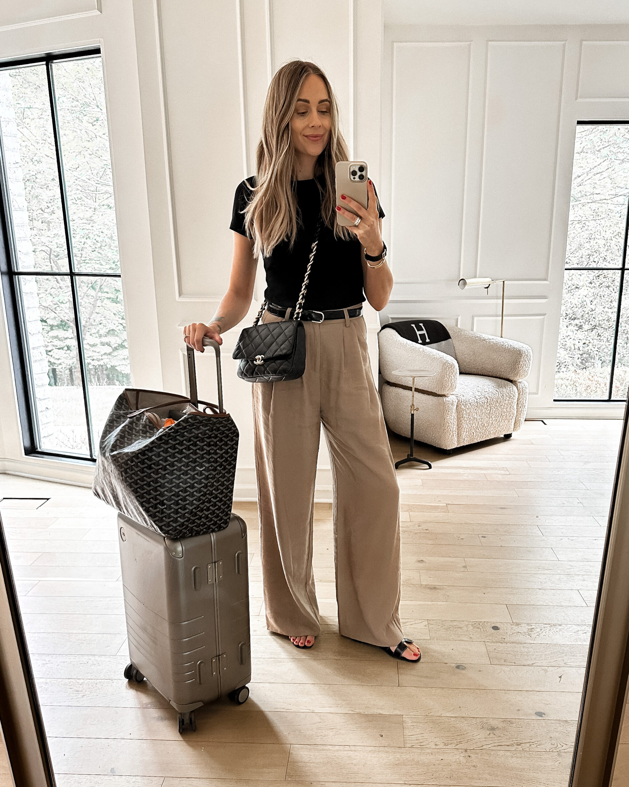 Fashion Jackson Wearing Short Sleeve Black Tee Tan Wide Leg Pants Black Hermes Oran Sandals Black Chanel Handbag Monos Carry-On Luggage Goyard GM Tote Fashion Jackson Wearing Short Sleeve Black Tee Tan Wide Leg Pants Black Hermes Oran Sandals Black Chanel Handbag Monos Carry-On Luggage Goyard GM Tote