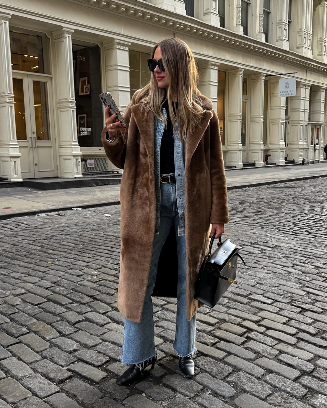 Fashion Jackson Wearing Brown Shearling Coat Denim Shirt AGOLDE Jeans Black Boots Vintage Hermes Kelly Sellier 32 nyc street style winter denim on denim outfit nyc winter outfits