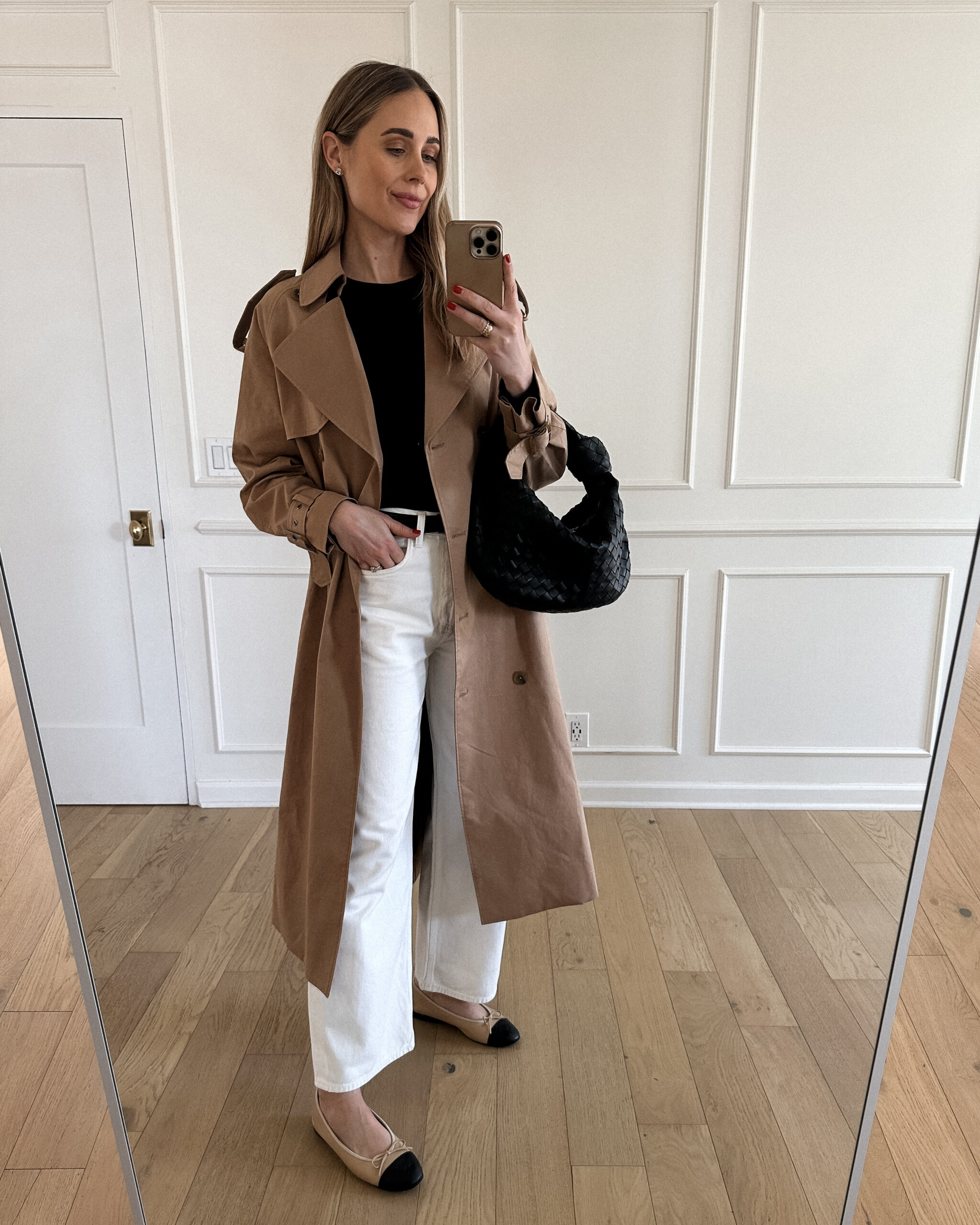 Fashion Jackson Wearing Mayson the label long trench coat, black long sleeve tee, white agolde jeans, chanel tan ballerina flats, bottega veneta black teen jodie