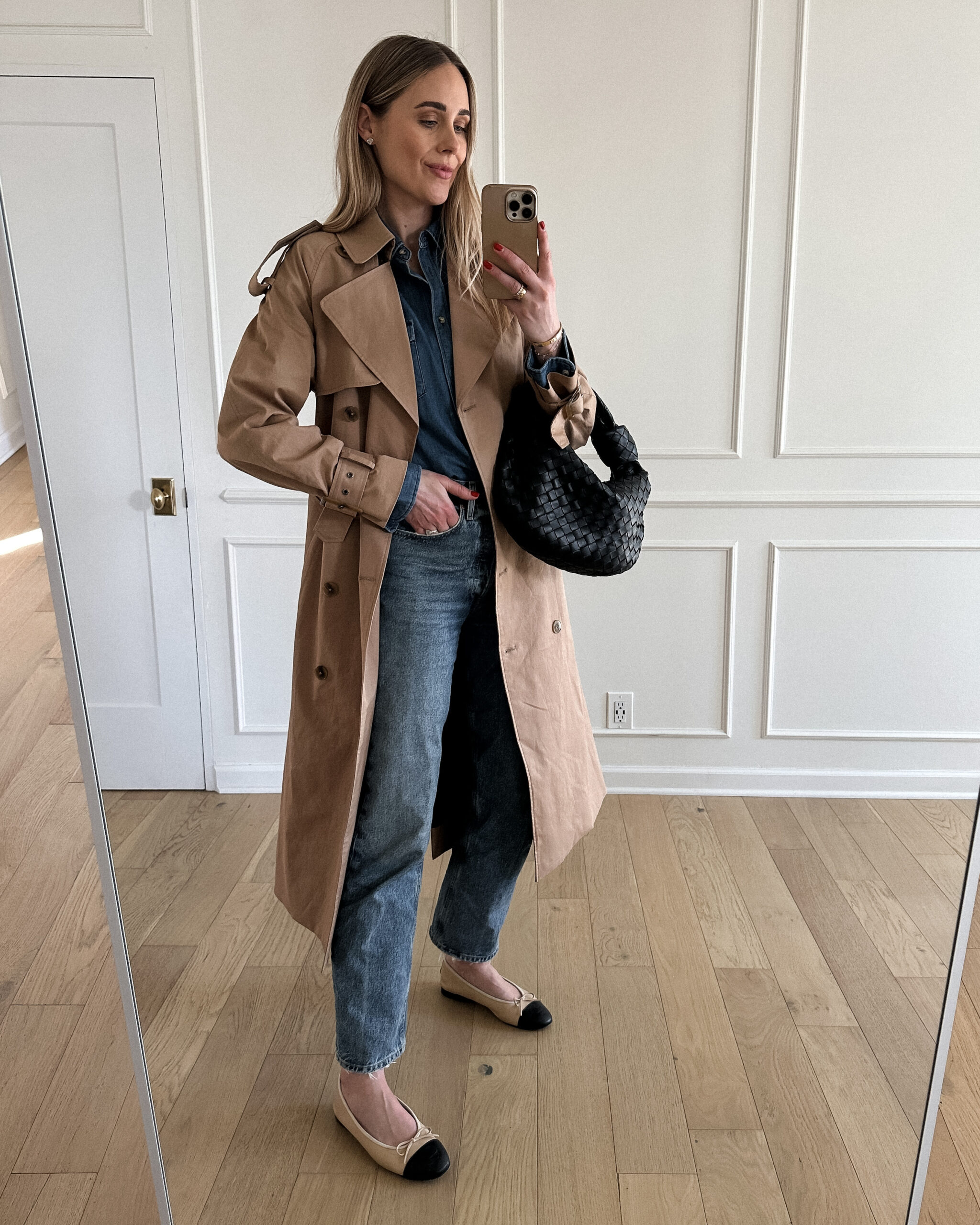 Fashion Jackson Wearing Mayson the label long trench coat, denim shirt, agolde denim jeans, chanel beige ballet flats, bottega veneta teen jodie black