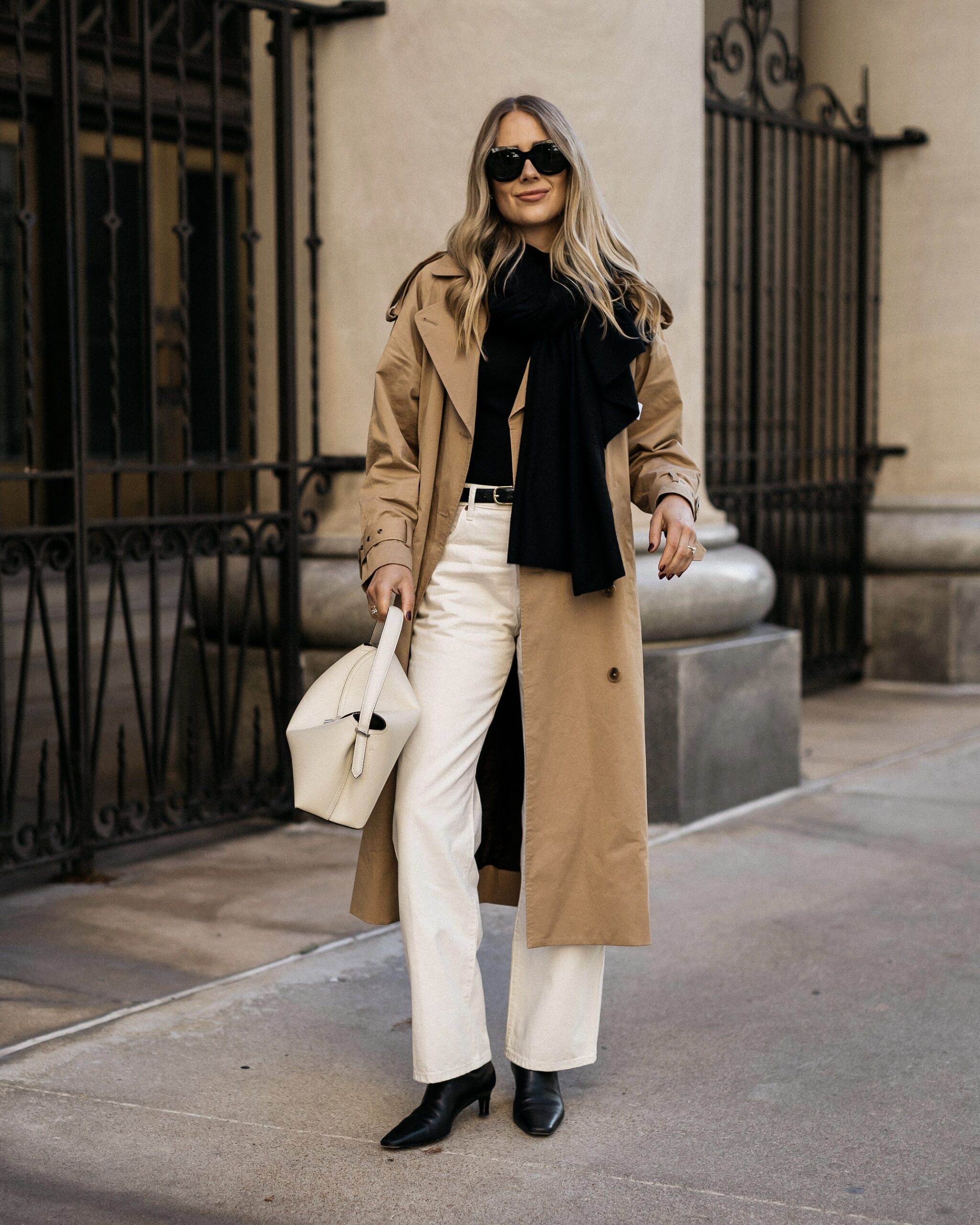Fashion Jackson Wearing Long Trench Coat White Jeans Black Scarf Black Booties Winter Spring Transitional Outfit